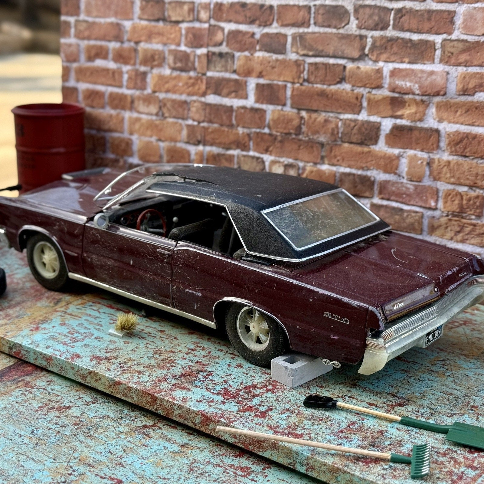 Maisto 1965 Pontiac GTO Maroon 1/18 Scale Diecast Model Car | Diorama Parts Car - Product Image