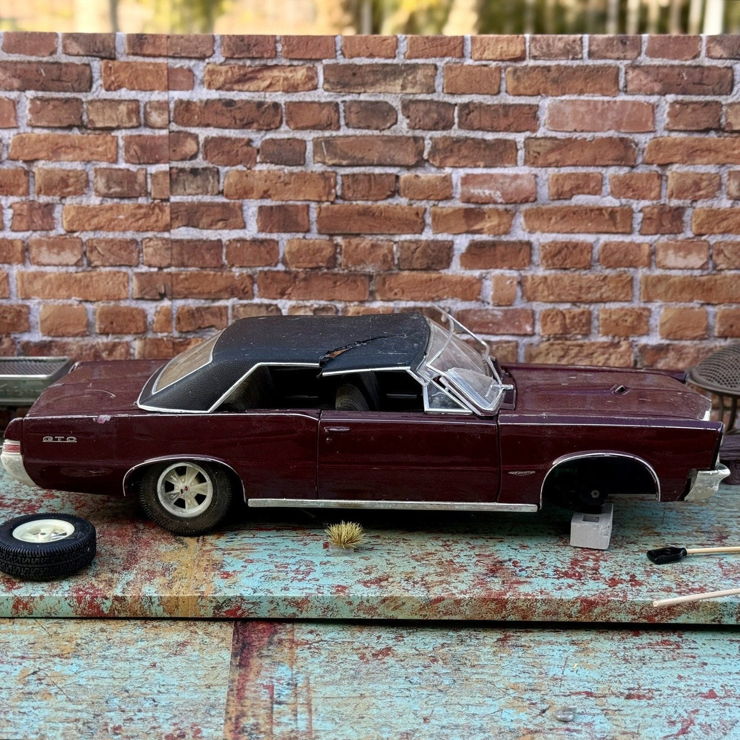 Maisto 1965 Pontiac GTO Maroon 1/18 Scale Diecast Model Car | Diorama Parts Car - Product Image