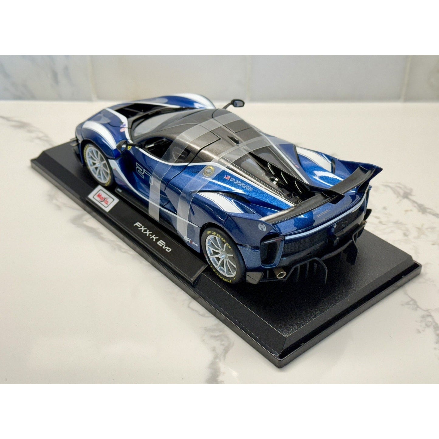 Maisto Ferrari FXXK Evo '#27 Blue P. Mann' Blue 1/18 Scale Diecast Model Car | New - Product Image