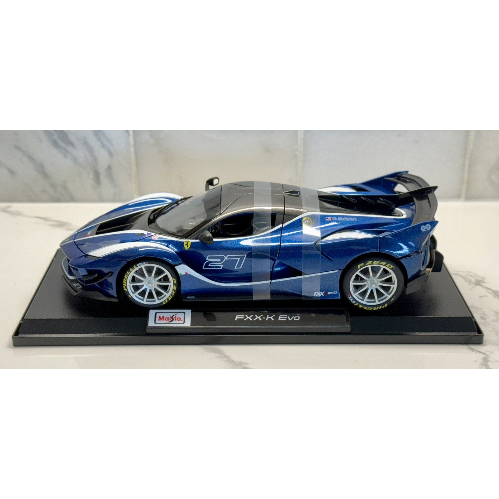 Maisto Ferrari FXXK Evo '#27 Blue P. Mann' Blue 1/18 Scale Diecast Model Car | New - Product Image
