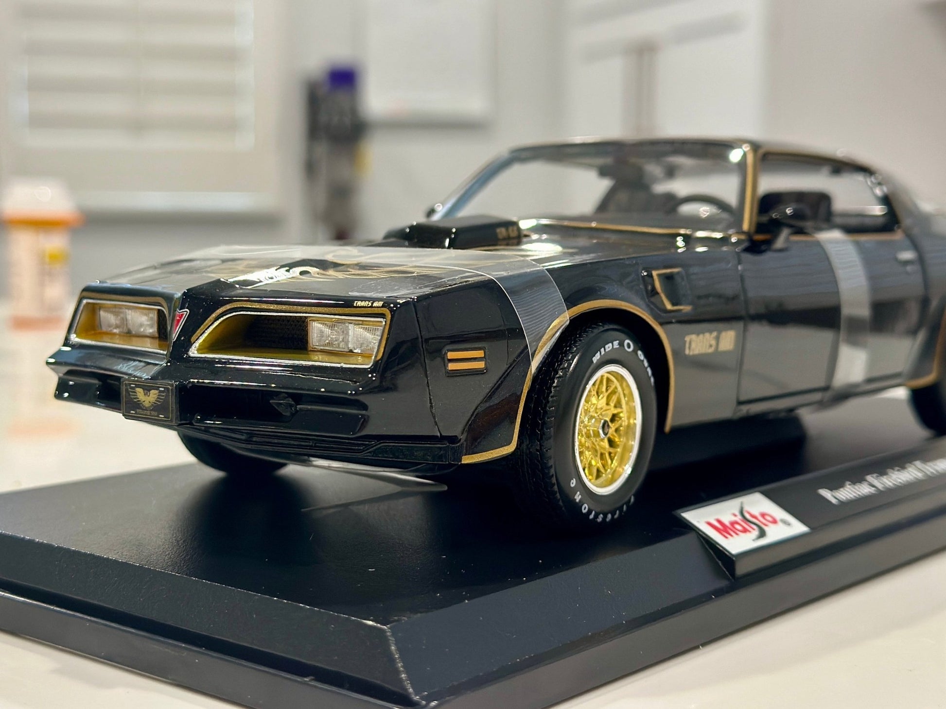 Maisto Pontiac Trans Am Firebird Black w/ Gold Livery 1/18 Scale Diecast Model Car | New - Product Image